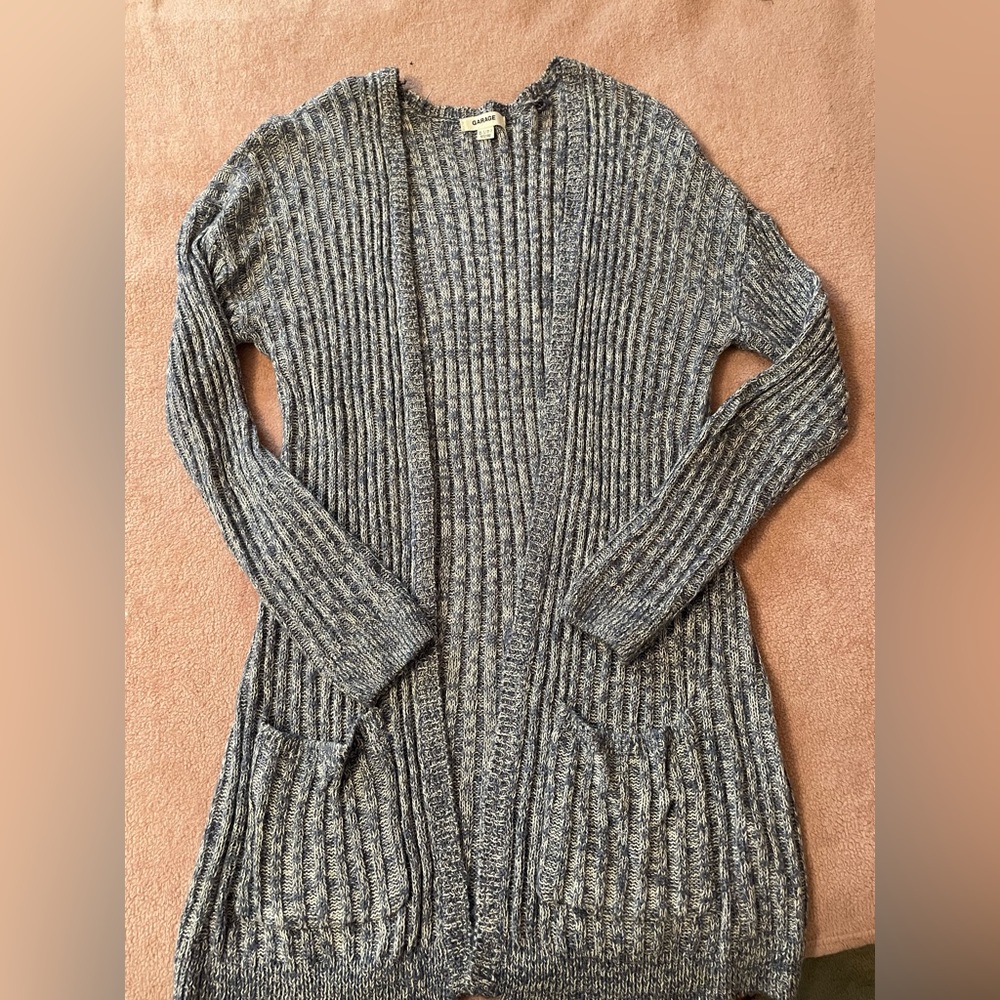 Super cute lightweight baby blue cardigan with pockets. Size XS/S